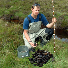 Reporting wildlife crime; Donald Shields with an illegal pearl fishing kill from a remote site in Wester Ross (© Peter Cosgrove).